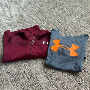 Under Armour shirts size 2T. Mild cracking on emblems